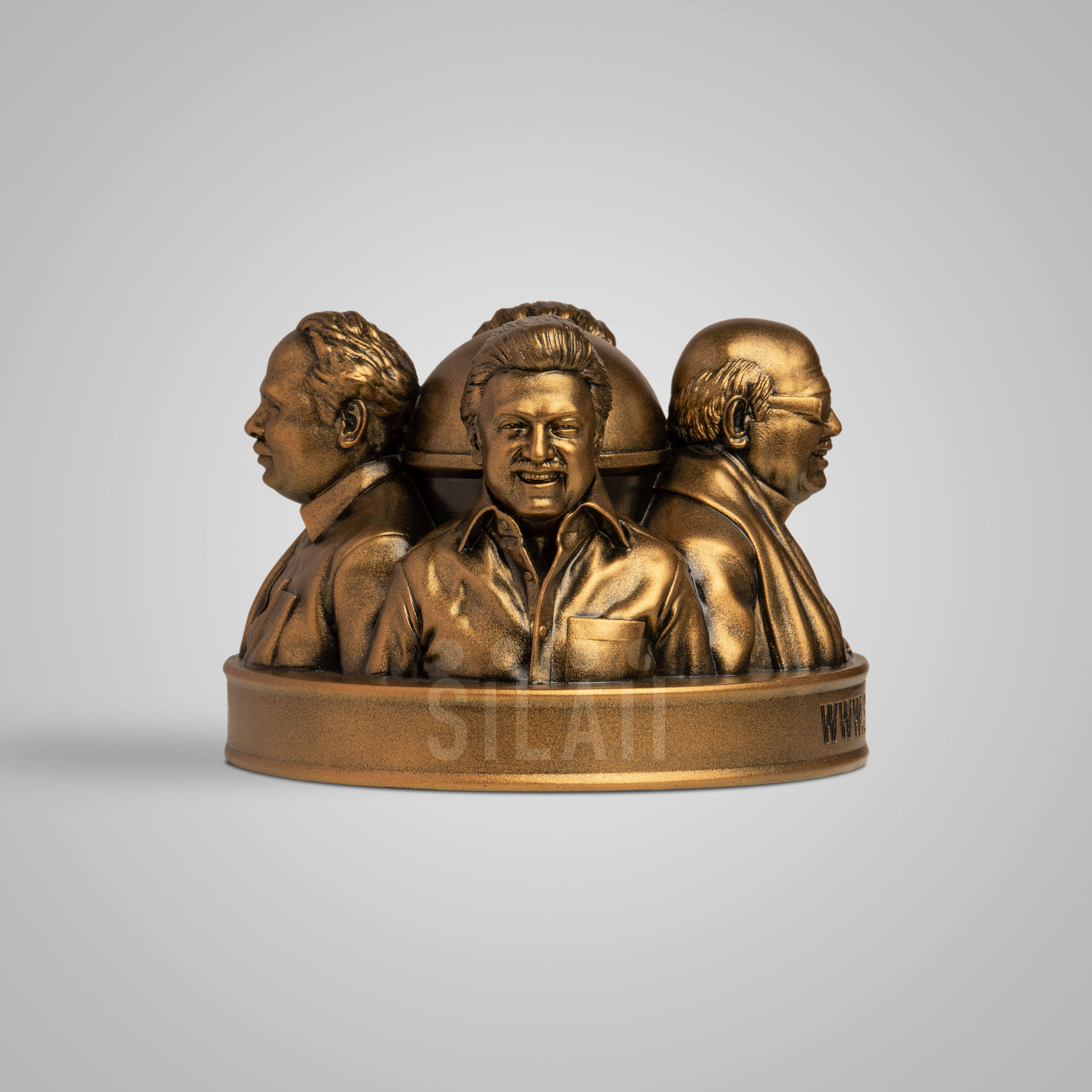 Gold-colored Dravidian leaders tabletop sculpture with detailed faces and traditional attire