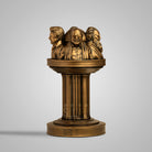 Gold-colored Dravidian leaders pillar sculpture with detailed faces and traditional attire