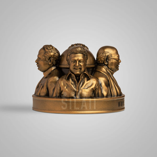 Gold-colored Dravidian leaders tabletop sculpture with detailed faces and traditional attire