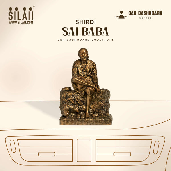 Bronze sculpture of Sai Baba on car dashboard